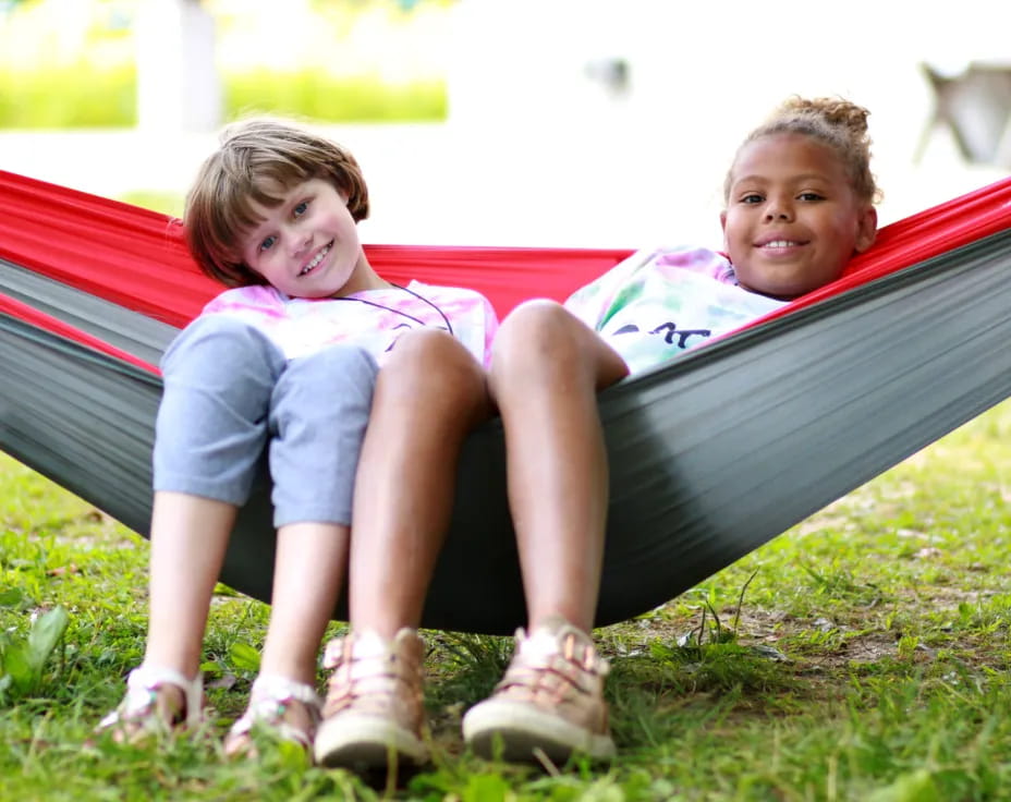two children sitting on a bench