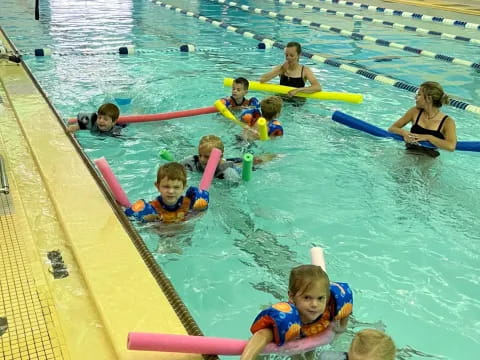 a group of people in a pool