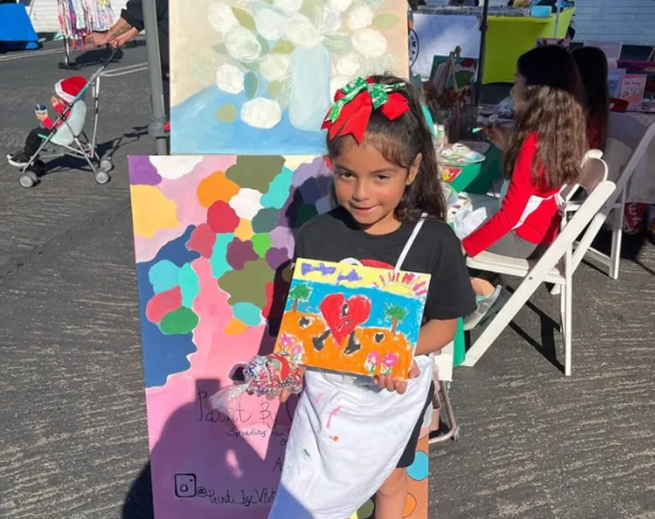 a girl holding a kite