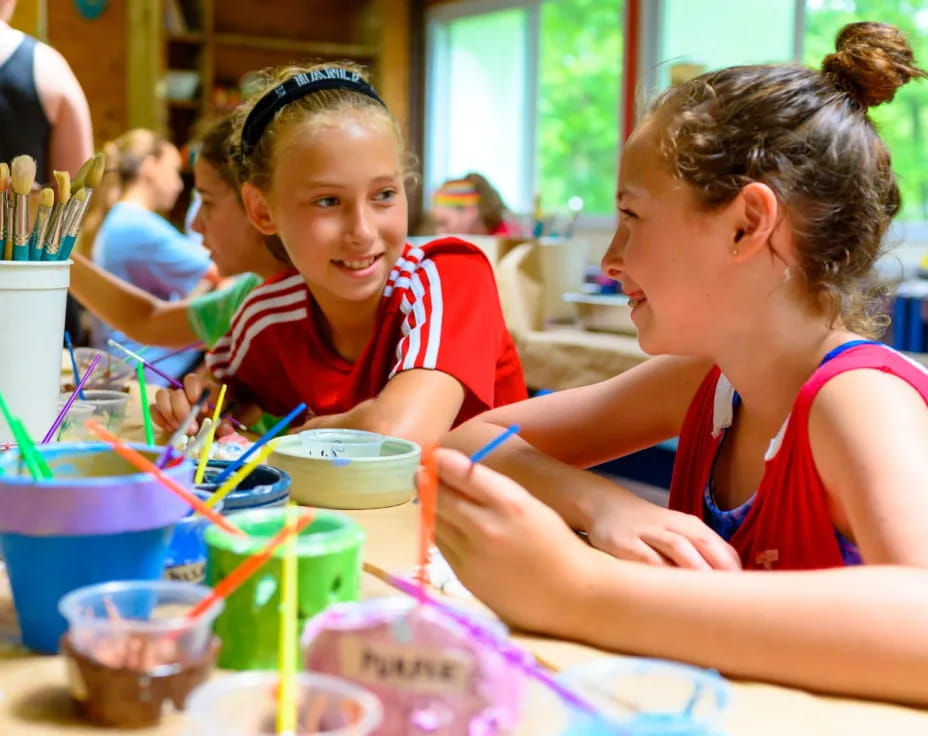 a few young girls painting