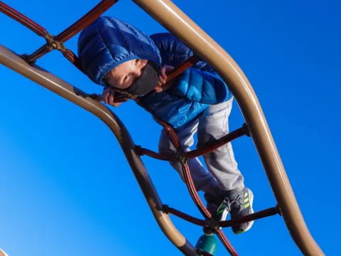 a child climbing a slide
