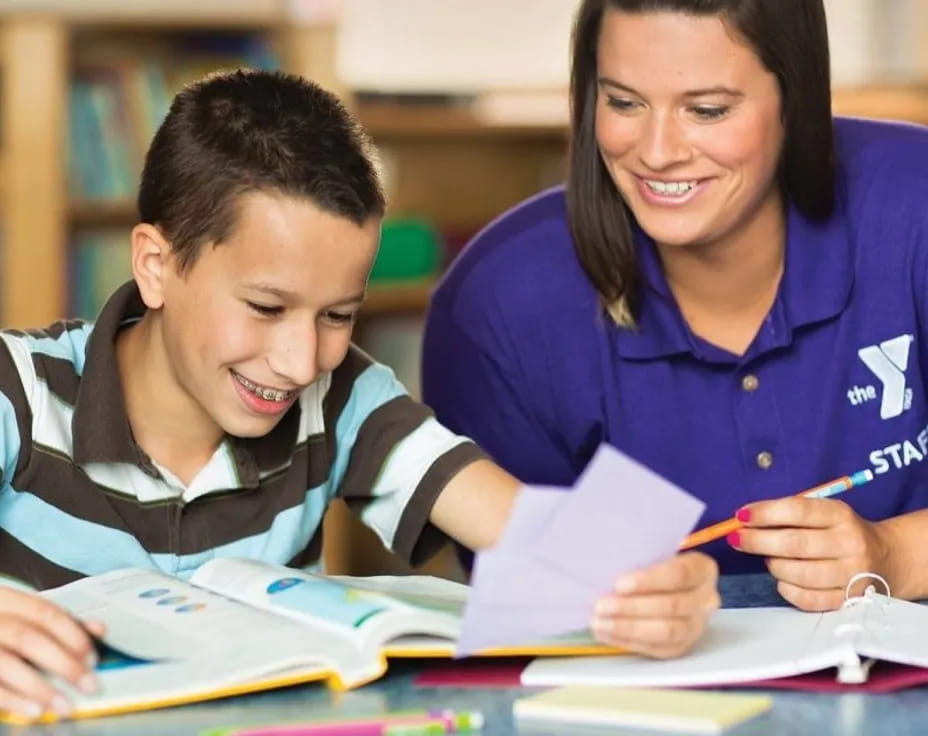 a person and a boy studying