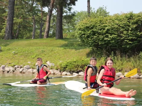 a group of people in kayaks