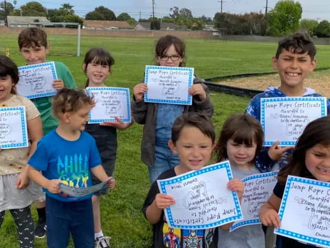 a group of children holding signs