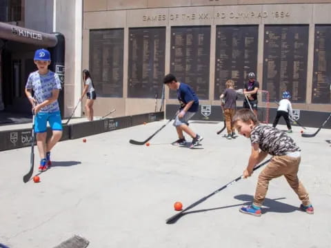 a group of people playing hockey