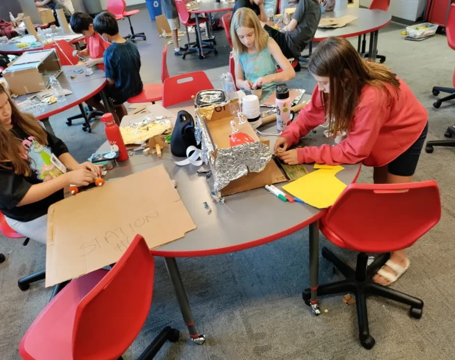 a group of people sitting at tables
