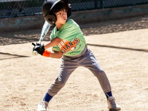 a young boy playing baseball