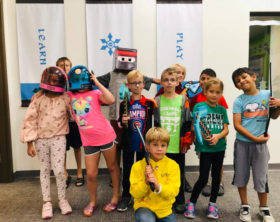 a group of kids wearing helmets