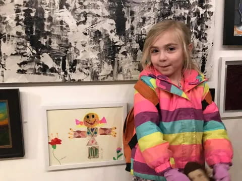 a girl holding a picture