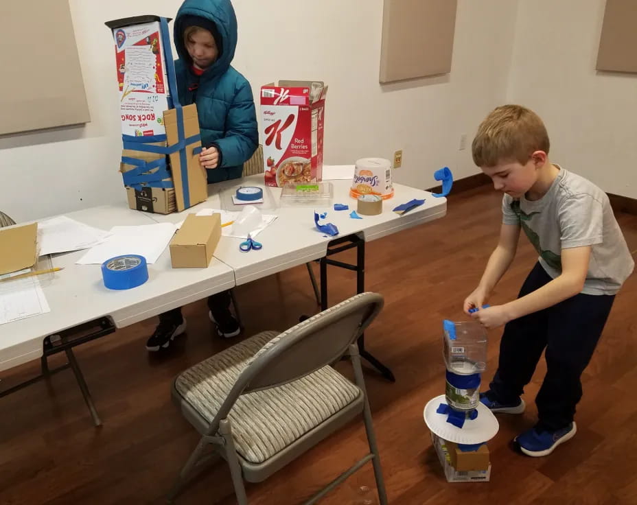 a boy and a girl painting
