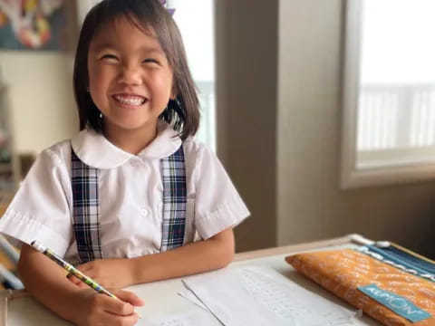 a young girl smiling