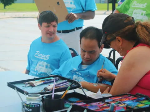 a group of people painting