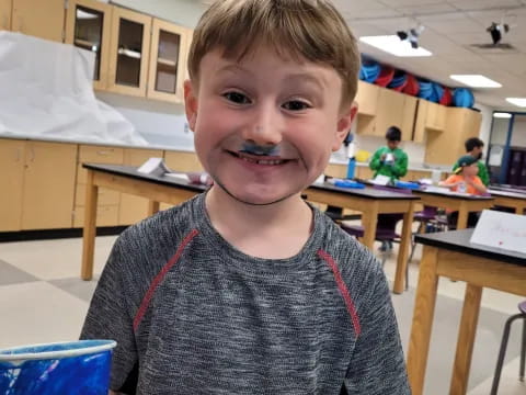 a boy smiling for the camera