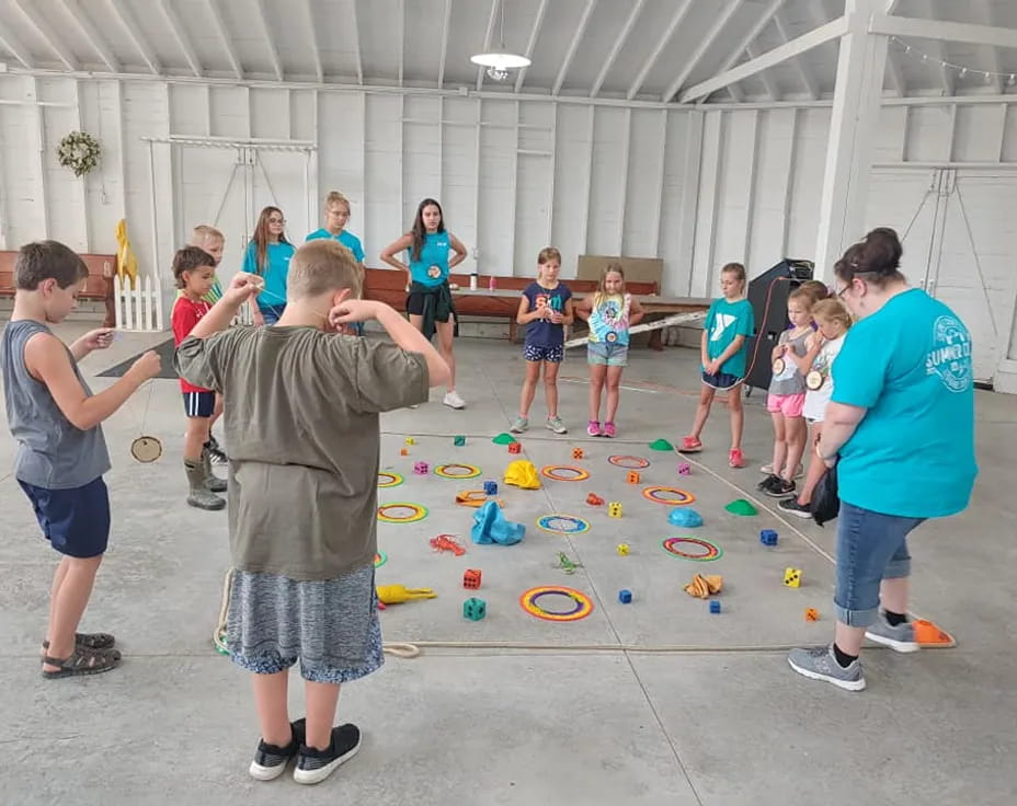 a group of people playing with toys