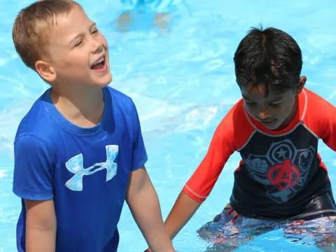 a couple of boys in a pool