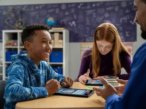 a few people looking at a tablet