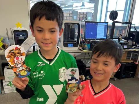 a couple of boys holding a toy