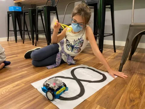 a child playing with a toy car