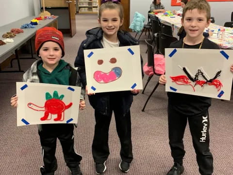 a group of children holding signs