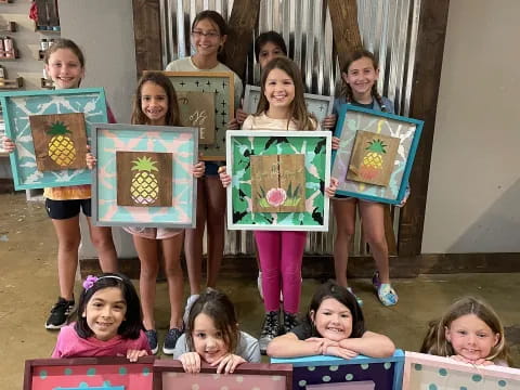 a group of children holding books