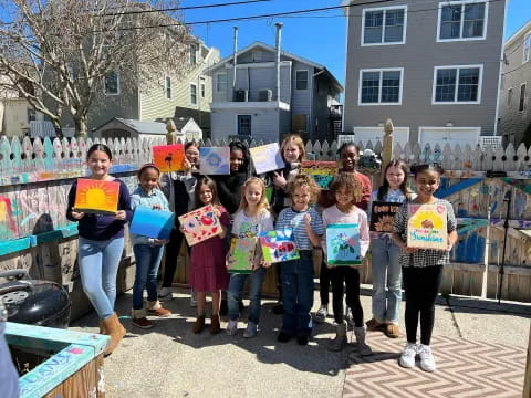 a group of children holding signs