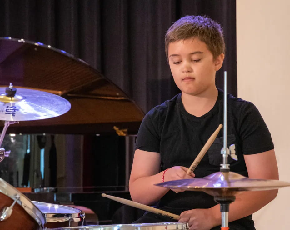 a boy playing drums