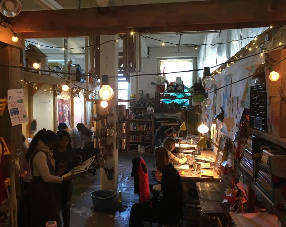 people in a room with shelves