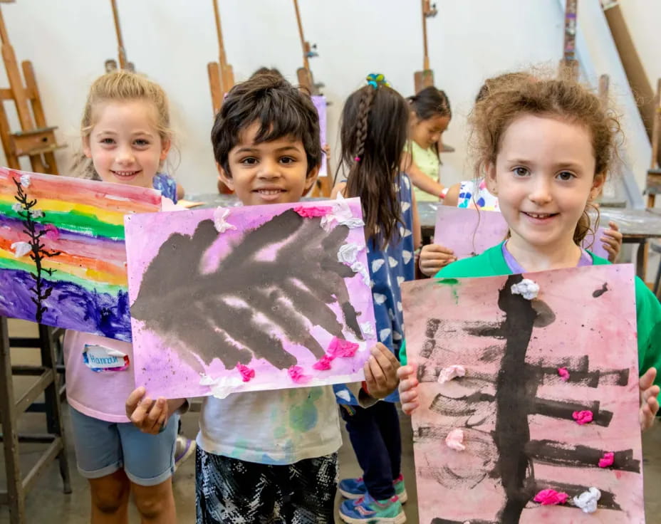 a group of children holding signs