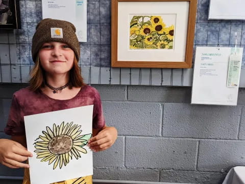 a woman holding a plaque