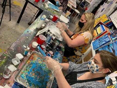 a group of people painting