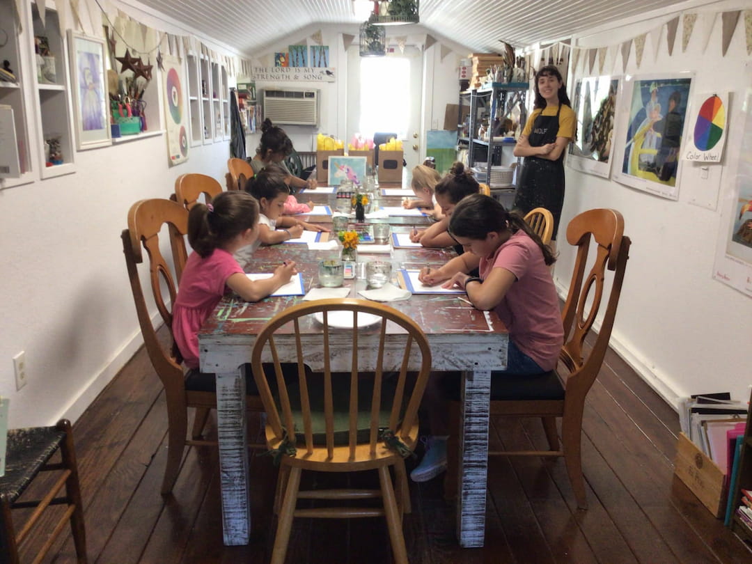 a group of people sitting around a table