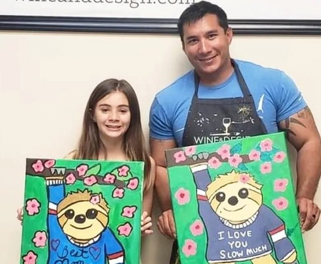 a man and a woman holding a book