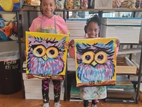 two girls holding colorful bags