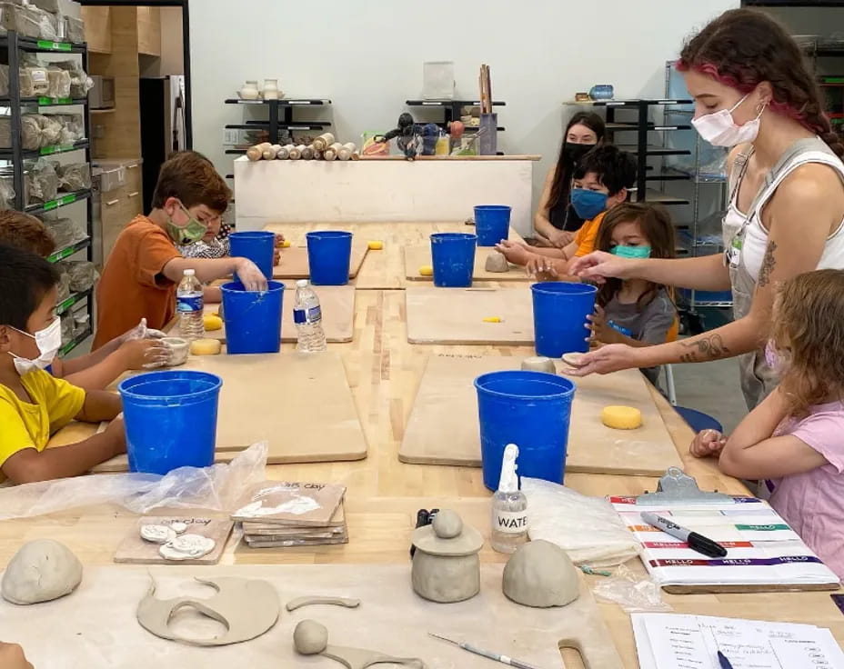 a group of children painting