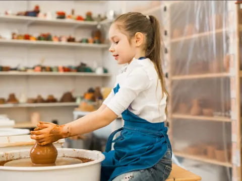 a young girl making a cake
