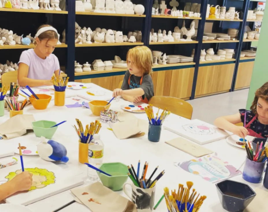 a group of children painting