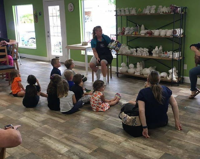 a group of people sitting on the floor