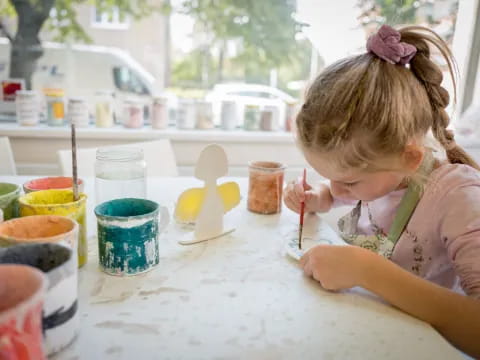 a little girl painting