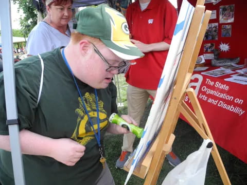 a man painting a picture