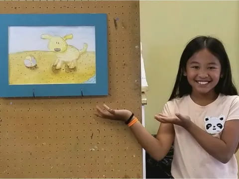 a girl smiling next to a painting