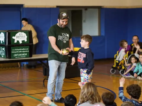 a person and a boy in a gym