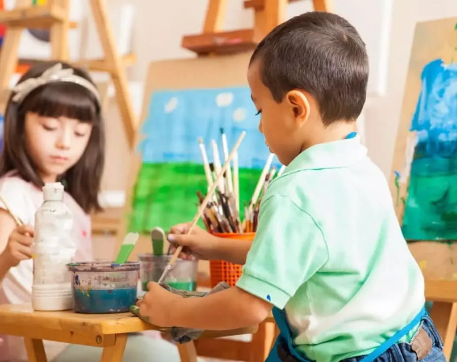 a boy and girl painting