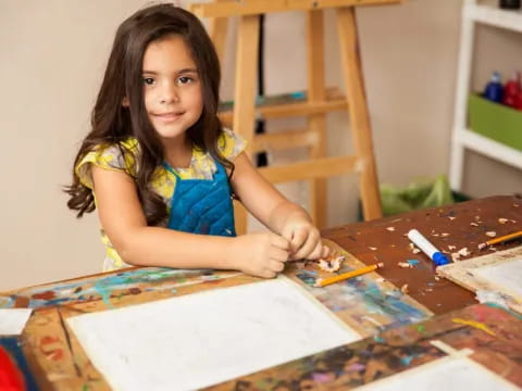a girl sitting at a table