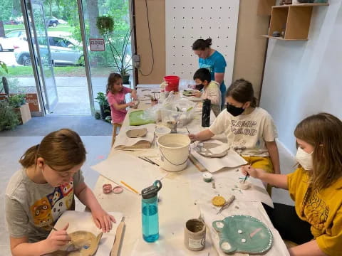 a group of people painting