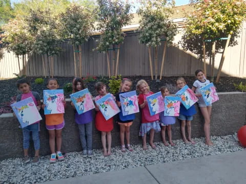 a group of children holding signs