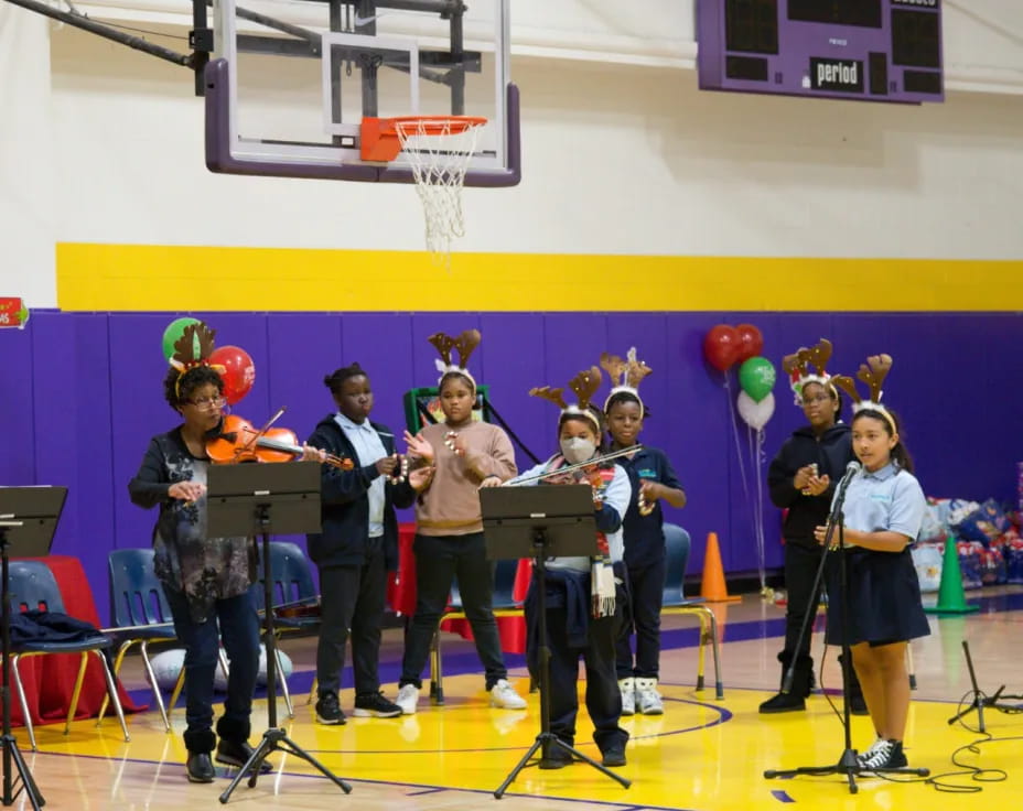 a group of kids in a gym