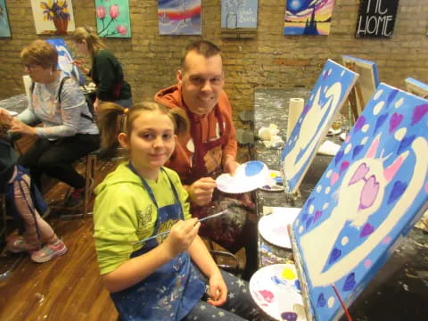 a group of children painting