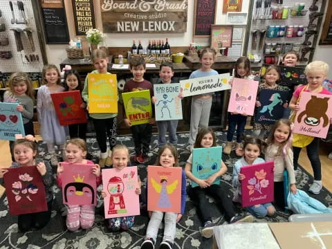 a group of children holding signs