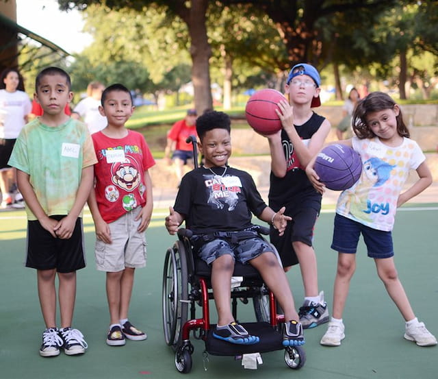 a group of kids playing with a ball