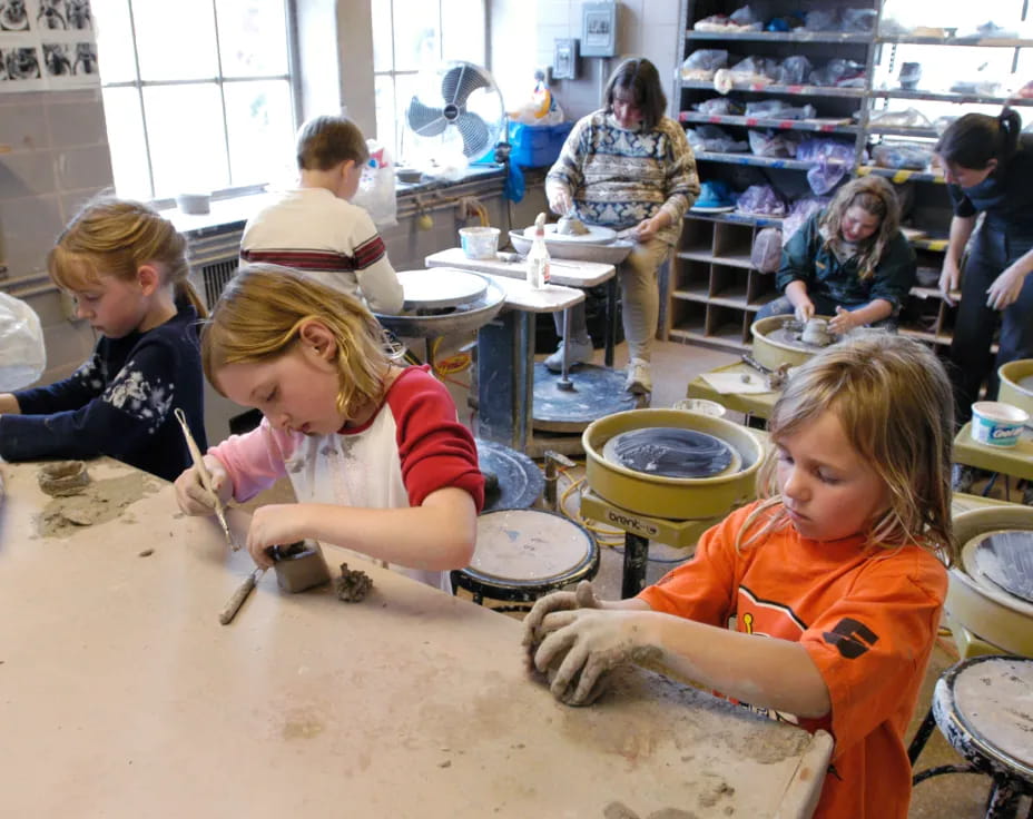 a group of children playing drums